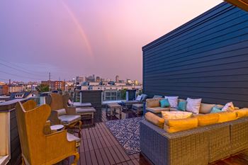 a rainbow is seen over the rooftops of san francisco